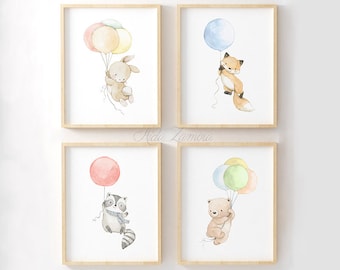 May include: Set of four watercolor prints featuring a fox, a raccoon, a bear, and a bunny rabbit holding onto colorful balloons. Each print is framed in a light wood frame.