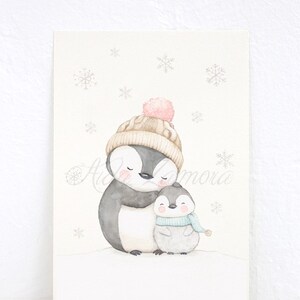 May include: A watercolor illustration of two penguins wearing winter hats and scarves. The larger penguin is wearing a brown and beige hat with a pink pom-pom. The smaller penguin is wearing a blue scarf and a gray hat. The penguins are standing on a white background with snowflakes.