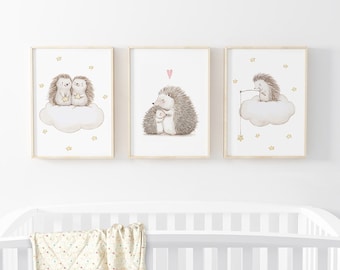 May include: Three framed prints featuring illustrations of hedgehogs on clouds with stars. The first print shows two hedgehogs holding stars, the second print shows a hedgehog couple with a heart above them, and the third print shows a hedgehog fishing for a star.