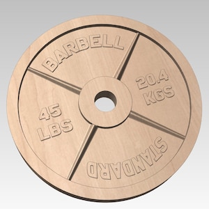 May include: A wooden weight plate with the text "BARBELL STANDARD" and "45 LBS" on one side and "20.4 KGS" on the other side.