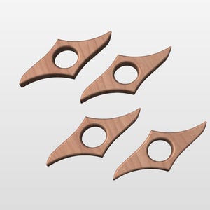May include: Four wooden bookends shaped like a diamond with a rounded hole in the centre. The bookends are a light brown colour.