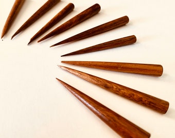Handmade wooden tip to clean pipe.