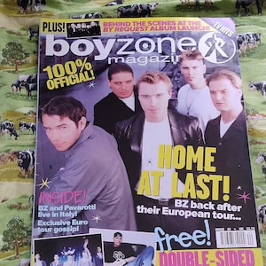 May include: A Boyzone magazine cover with the headline "HOME AT LAST!" and "DOUBLE-SIDED GIANT POSTER!". The cover features images of the band members and text about their European tour and a concert in Italy. The magazine is issue 40.