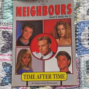 May include: A vintage magazine titled Neighbours Who's Who No. 11, featuring five portraits of actors on the cover. The cover includes the text S.M.G presents, Neighbours Who's Who No. 11, Time After Time, and An Independent Publication, with a price of £1.50.