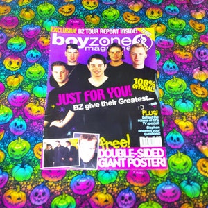 May include: A Boyzone magazine with the headline "JUST FOR YOU!" and a free double-sided giant poster. The cover features five men and is set against a vibrant background of colorful Halloween pumpkin designs.