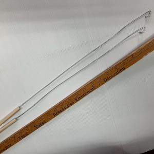 Two (2) puppet arm rods