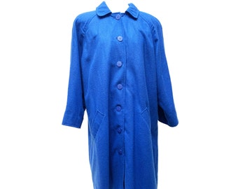 May include: A long, royal blue coat with a classic design. The coat has a collared neckline, button-down closure, and two front pockets. The sleeves are long, and the coat is made of a soft, textured fabric.