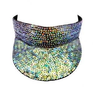May include: A black visor with iridescent blue, green, and yellow sequins. The sequins are arranged in a gradient pattern.