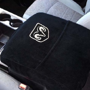 Fits Ram Classic Jump Seat and ALL Bucket Seat Models 2014-2025 Official Licensed Ram Logo Armrest Console Cover made in El Salvador BLACKC2