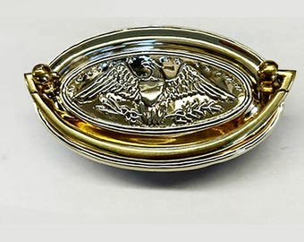 Tirador ovalado de águila americana