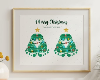 May include: Framed print featuring two green Christmas trees made from footprints, adorned with colorful lights and topped with gold stars. The text "Merry Christmas and a Happy New Year" is written above the trees.