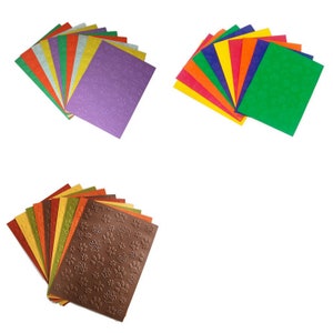 May include: Three sets of colorful cardstock paper. The first set is purple, green, yellow, orange, silver, and white. The second set is red, orange, yellow, green, blue, and purple. The third set is brown, orange, yellow, green, brown, and red with a paw print pattern.
