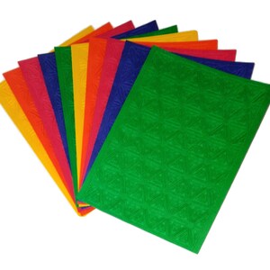 May include: A set of ten sheets of textured paper in various colors, including red, orange, yellow, green, blue, and purple. The sheets are arranged in a fan shape, with the green sheet on top.
