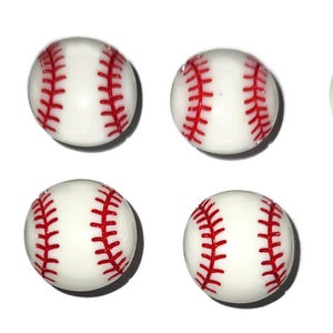 May include: Eight white baseballs with red stitching. The baseballs are arranged in two rows of four.