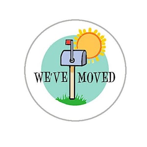 May include: A round sticker with a blue, green, and yellow design. A mailbox with a red flag is in front of a yellow sun. The text "WE'VE MOVED" is printed in black.