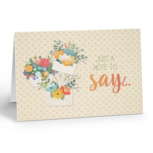 May include: A greeting card with a polka dot background and a floral design. The card features three envelopes with flowers spilling out of them. The text on the card reads "Just a note to say..."