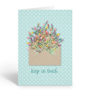 May include: A light blue card with white polka dots features a brown envelope with a bouquet of colorful flowers spilling out of the top. The text "keep in touch" is printed in teal below the envelope.