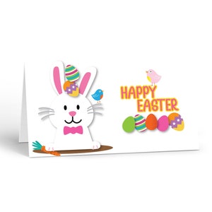 May include: A white bunny with pink ears and a bow tie is holding a carrot. The bunny is wearing a hat with colorful Easter eggs. The text "Happy Easter" is written in pink and orange letters. There are five colorful Easter eggs below the text.