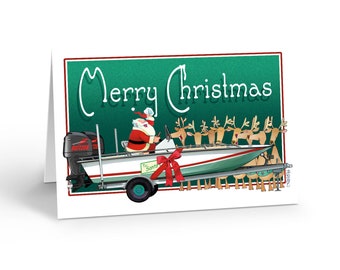 May include: A Christmas card featuring Santa Claus driving a boat with reindeer in tow. The boat is white and green, with a red bow. The words "Merry Christmas" are written in white on a green background.