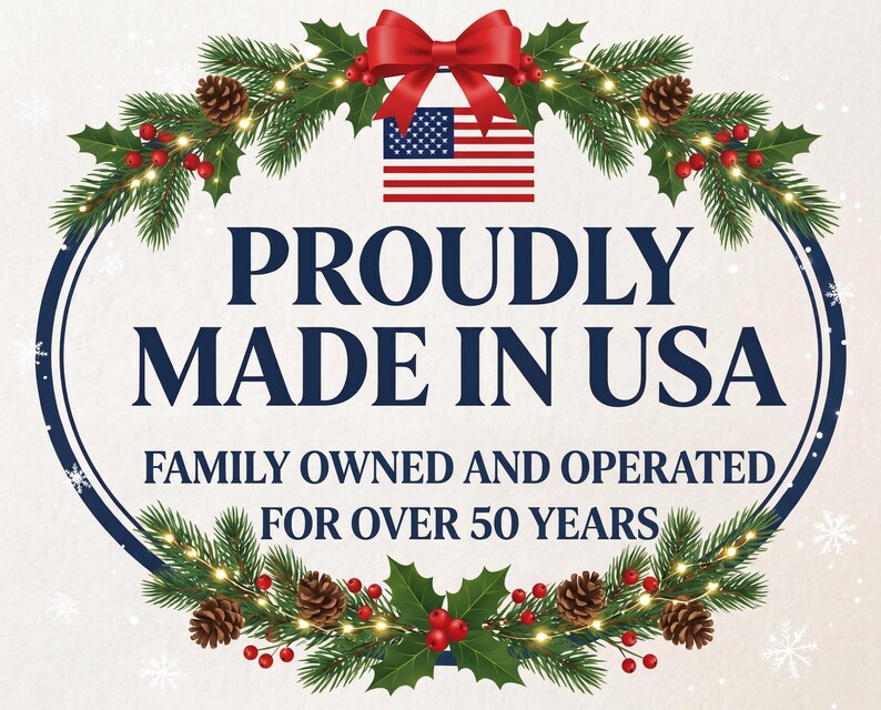 May include: A graphic design featuring a red bow at the top, a United States flag, and a festive wreath of pine branches, pinecones, and red berries. The text reads PROUDLY MADE IN USA and FAMILY OWNED AND OPERATED FOR OVER 50 YEARS in dark blue.
