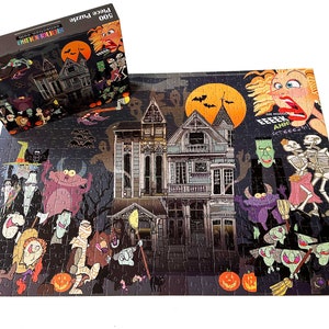 May include: A 500 piece jigsaw puzzle featuring a spooky haunted house with a variety of cartoon monsters and ghouls. The puzzle box shows a close-up of the haunted house with a witch and a skeleton.