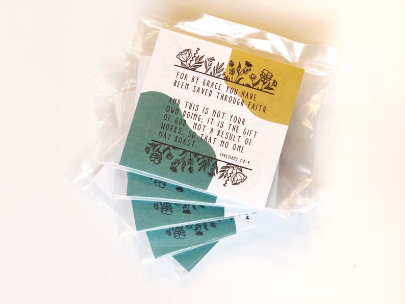 May include: Packaged cards with text: "FOR BY GRACE YOU HAVE BEEN SAVED THROUGH FAITH. AND THIS IS NOT YOUR OWN DOING; IT IS THE GIFT OF GOD, NOT A RESULT OF WORKS, SO THAT NO ONE MAY BOAST. EPHESIANS 2:8-9." The cards have a teal and gold color scheme with floral accents.