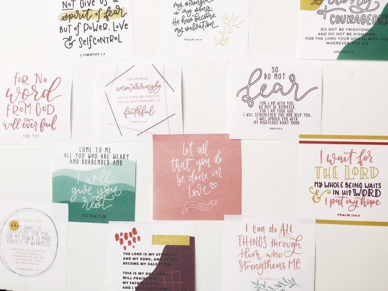 May include: A collection of square cards with handwritten inspirational quotes in various colors. The cards feature phrases like "So do not fear" and "Let all that you do be done in love."