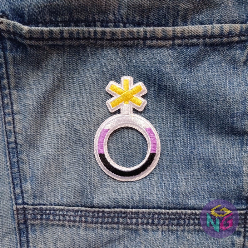 nonbinary patch iron on on blue denim background