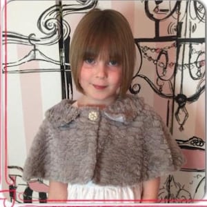 Child&#39;s Faux Fur Cape in a Feather Pattern