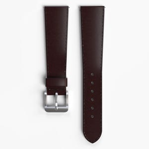 May include: Two brown leather watch straps with silver buckles. The straps are both the same length and width.