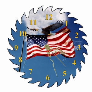 May include: A clock face with a saw blade design, featuring a bald eagle flying over an American flag against a blue sky background. The clock numbers are in yellow.