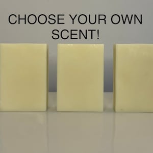 May include: Three bars of white soap, side by side, with the text "CHOOSE YOUR OWN SCENT!" above them.
