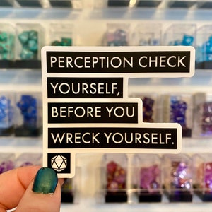 May include: White sticker with black text that reads "Perception Check Yourself, Before You Wreck Yourself."  A black and white image of a twenty-sided die is at the bottom of the sticker.