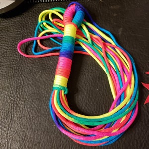 Blacklight reflective Rainbow paracord flogger