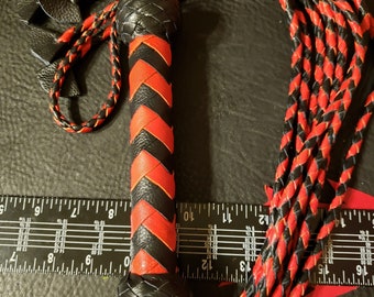 Red and black cat o nine tails flogger