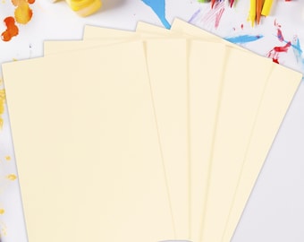 May include: A stack of six cream-colored paper sheets, perfect for crafting, drawing, or painting.