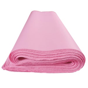May include: A roll of pink tissue paper, perfect for wrapping gifts or adding a touch of color to crafts.