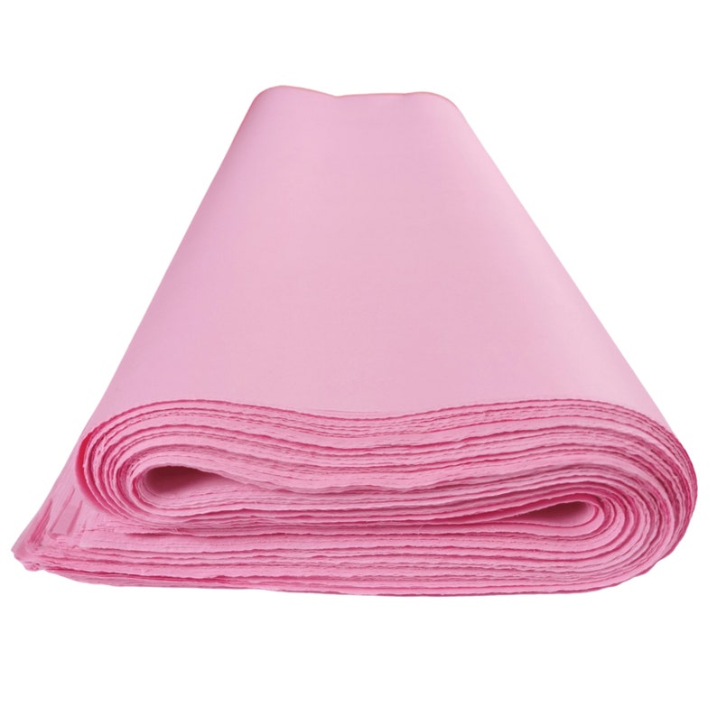 May include: A roll of pink tissue paper, perfect for wrapping gifts or adding a touch of color to crafts.
