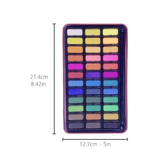 May include: A set of 36 watercolor paints in a metal tin with a brush. The tin is 8.42 inches tall and 5 inches wide. The paints are arranged in rows of six, with each color having its own individual pan. The colors are a mix of bright and muted shades, including red, orange, yellow, green, blue, purple, brown, and black.