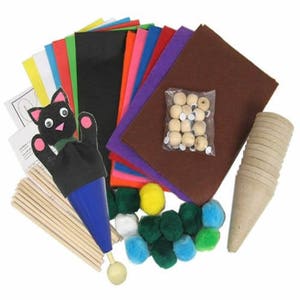 May include: A craft kit for making a puppet. The kit includes felt sheets in various colours, googly eyes, wooden beads, a black felt cat puppet, a cone-shaped cardboard base, wooden dowels, and pom-poms in various colours.