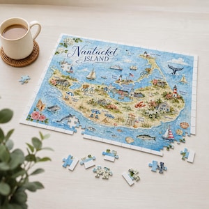 May include: A rectangular jigsaw puzzle featuring a detailed illustrated map of Nantucket Island with the text Nantucket Island, including depictions of lighthouses, sailboats, marine life, and coastal scenery, with several loose puzzle pieces.
