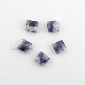 May include: Five square-shaped amethyst cabochons with a purple and white color pattern. The cabochons are approximately 10mm in size.