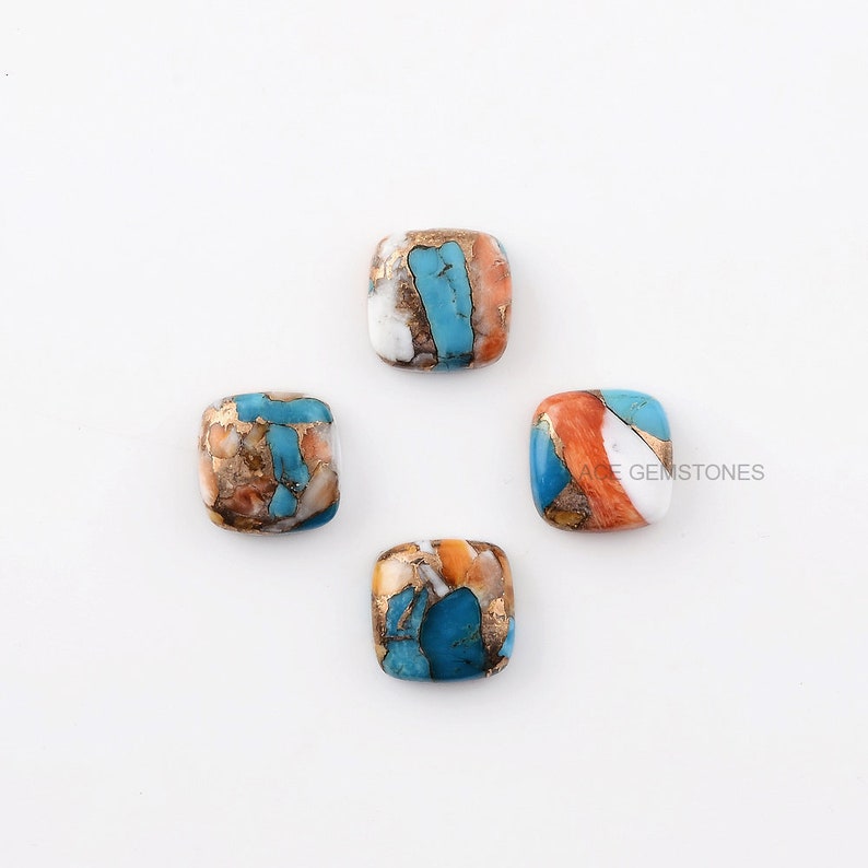 May include: Four square-shaped turquoise cabochons with orange, white, and gold accents. The cabochons are set against a white background.