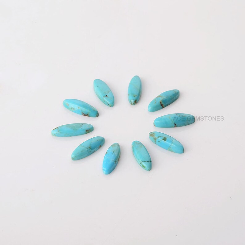 May include: A collection of eleven oval-shaped turquoise gemstones arranged in a circular pattern. The stones have a polished finish with brown veining, set against a white background. The text "ACE GEMSTONES" is visible in the image.
