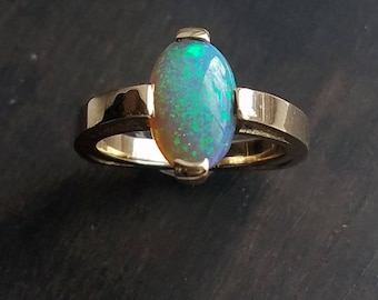 Australian opal 14k yellow gold ring, custom made one of a kind  Australian opal 14k gold ring.