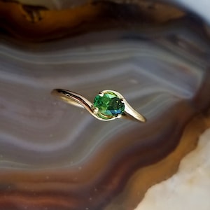 Maine tourmaline east-west design ring, bypass design 14k gold ring with Maine green tourmaline.