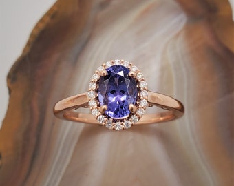 Tanzanite diamond ring, 14k rose gold ring with diamond halo and tanzanite.