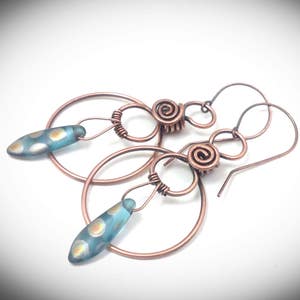 Copper wire earrings.. Wire wrapped jewelry. Wire jewelry. Antiqued copper wire wrapped hoop earrings w/Czech daggers. Handcrafte jewelry.