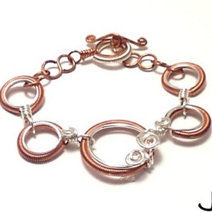 Two tone silver and copper coiled linked bracelet.  Wire wrapped bracelet
