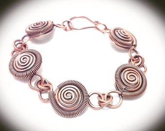 Copper bracelet., Antiqued copper linked coiled spirals. Elegant.